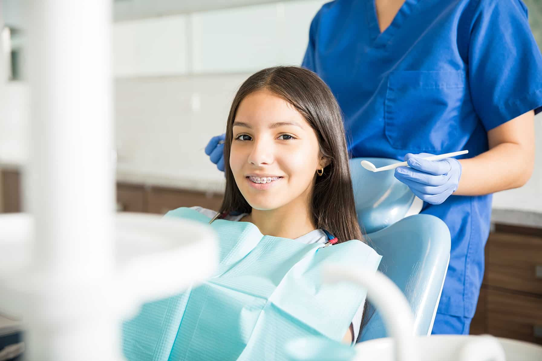 woman during a traditional braces placement appointment in west reading Pennsylvania