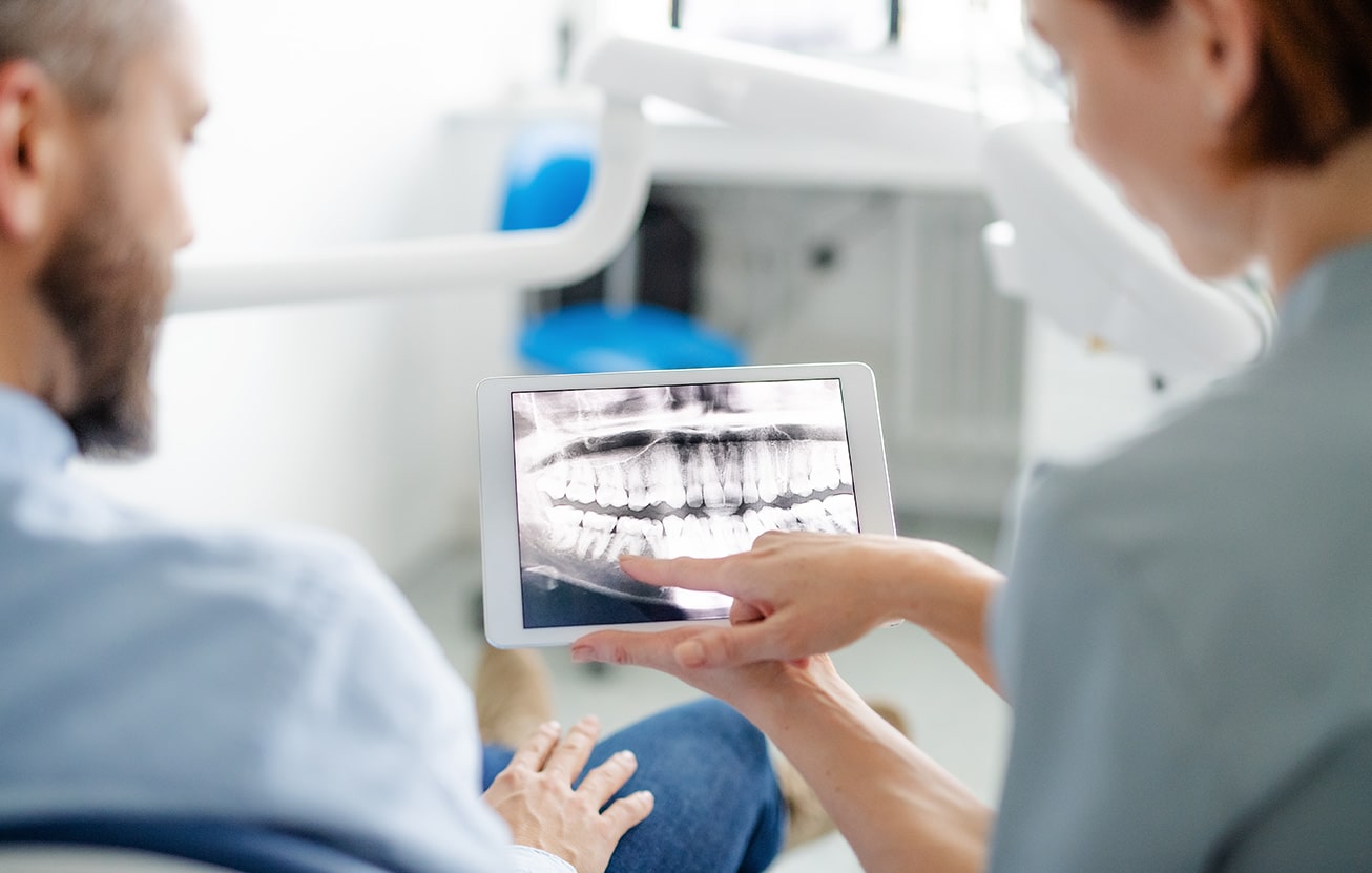 dr martin explaining dental xrays to ortho patient at Martin Family Orthodontics